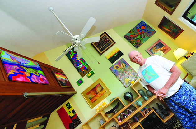 Frank Oliva casually standing in his Kailua art studio