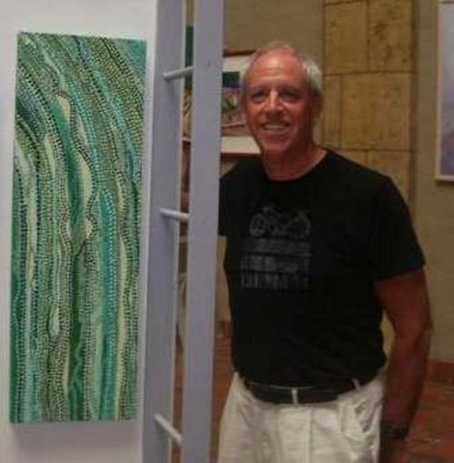 Frank Oliva casually standing in his Kailua Art Studio