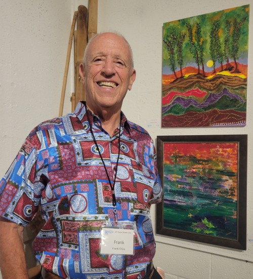 Frank Oliva standing in front of his art exhibit at "62nd annual WAG Member Show" 