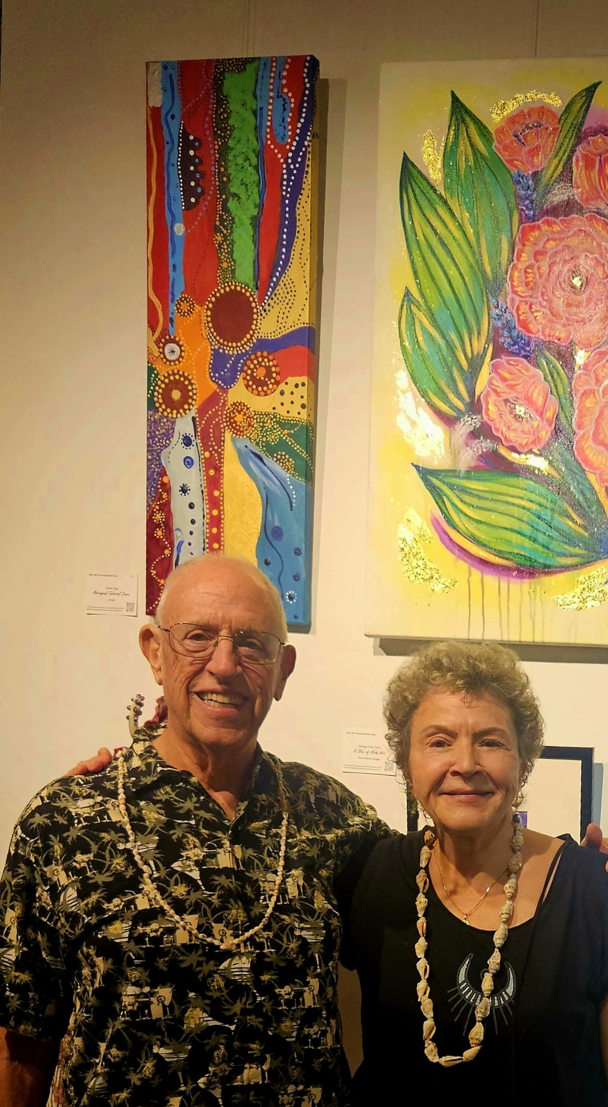 Frank and Connie in front of the colorful art